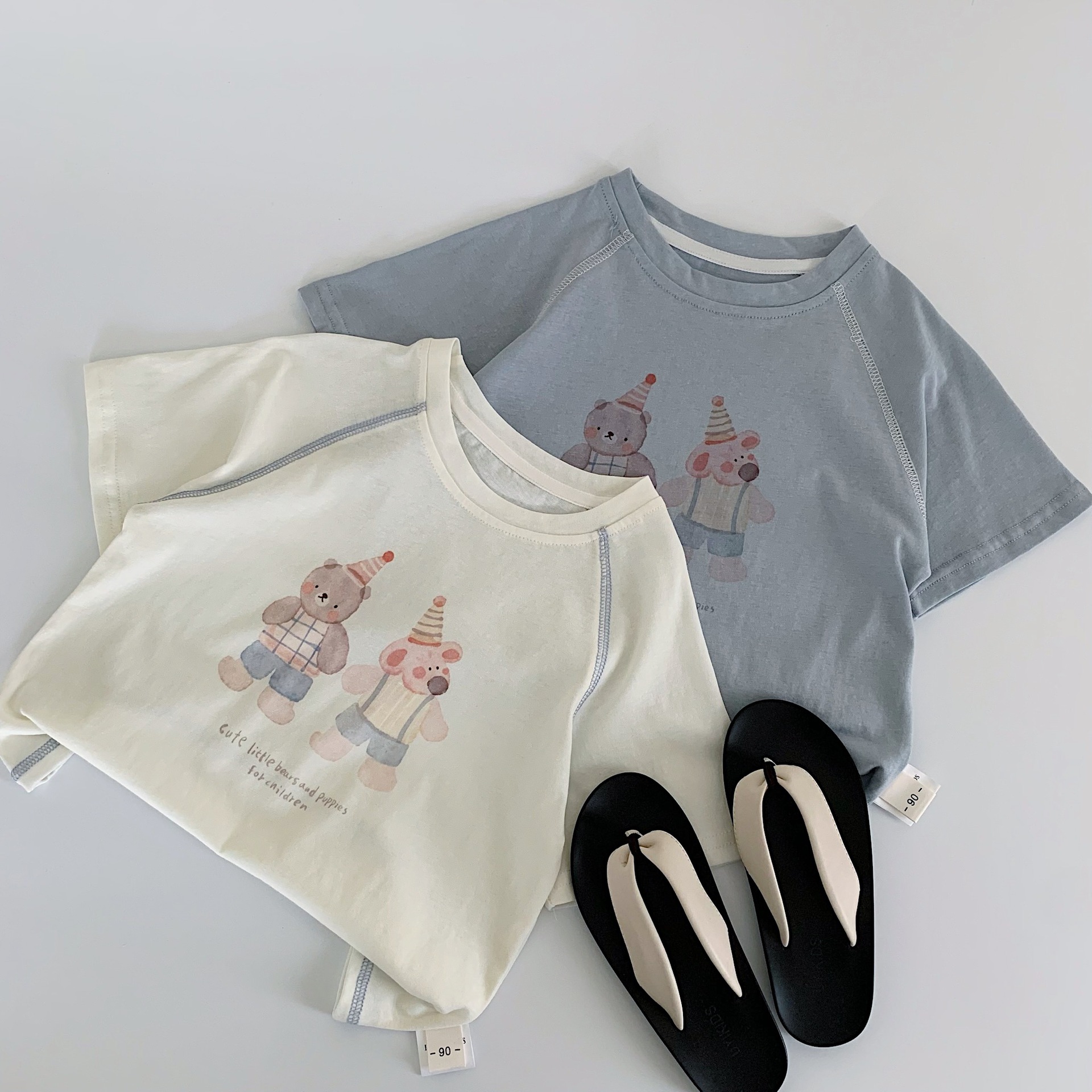 Maibao niños verano manga corta 2025 nuevos niños y niñas dibujos animados oso camiseta salvaje Huzhou Zhili ropa para niños clase a