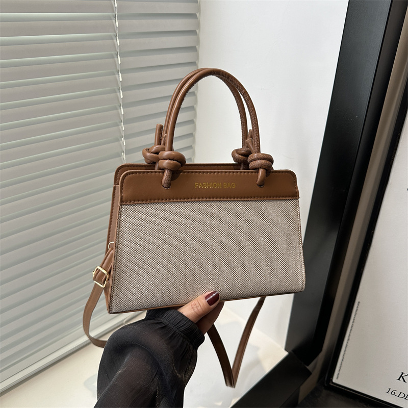 Bolso de mano damas 2025 nueva primavera y verano textura superior nicho de gran capacidad retro bolso de mano tote