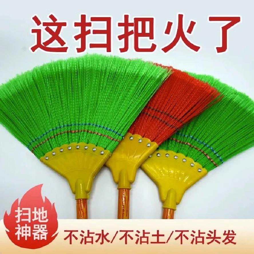 Wide-bristled plastic broom with wooden handle and eight nails, handmade broom for school and home cleaning