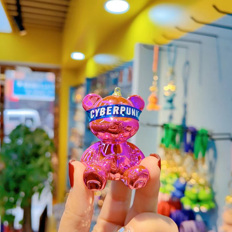 Resina de dibujos animados colorido gradiente oso llavero creativo postura sentada red oso llavero de moda colgante de llave de automóvil