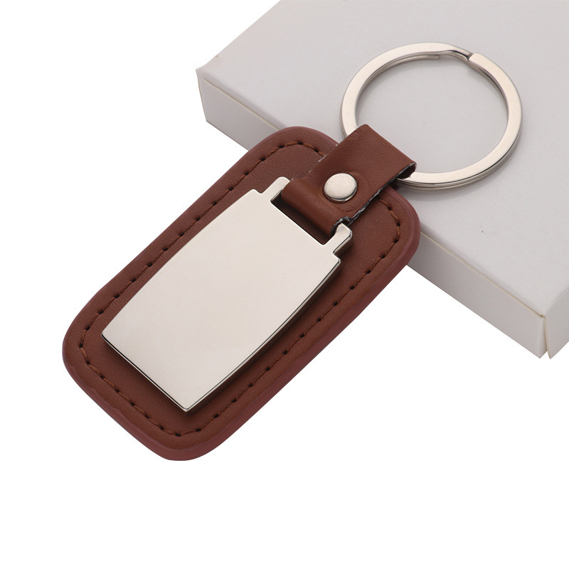 Llaveros de cuero al por mayor de fábrica, logotipo imprimible con láser, regalos promocionales para coches, llaveros de cuero, modernos y sencillos.