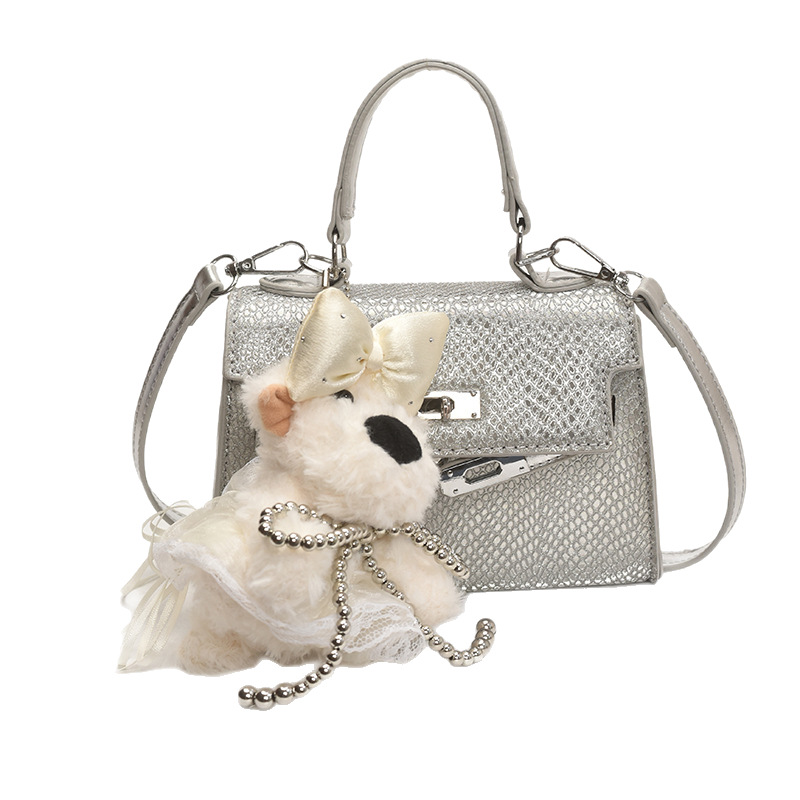 Bolso Kelly portátil de alta gama de moda transfronteriza para mujer 2025 nuevo estilo salvaje estilo occidental color sólido bolso de mensajero casual de un solo hombro