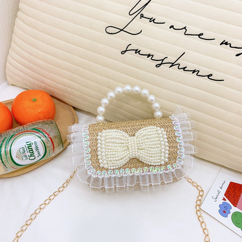 2025 nuevo regalo para niñas para niñas jardín de infantes Día de los niños arco de perla tela de paja bolso de hombro