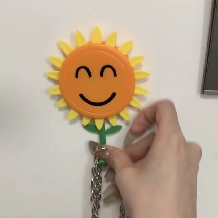 Telescopic cartoon storage system with sunflower extract, fridge magnet