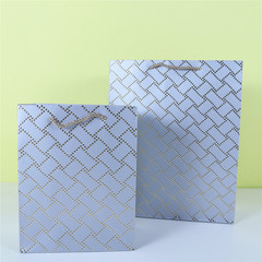 Threaded hot stamping white card gift bag irregular connection hot stamping platinum paper bag clothing shopping bag wholesale