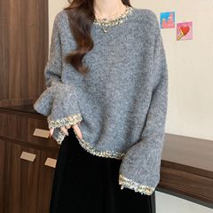怠惰な風の長袖はゆったりしていて、やせています。