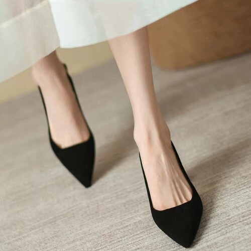 Oversized round-toe wedge sandals with a black, open-toe design featuring a pointed toe, a back strap, and a mid-heel. Perfect for summer fashion.