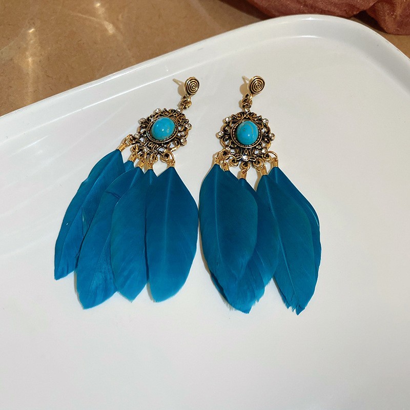 Pendientes de borla de cuentas de arroz con plumas de gota de agua bohemia Pendientes de estilo de vacaciones retro de nicho Pendientes de estilo étnico de lujo ligero