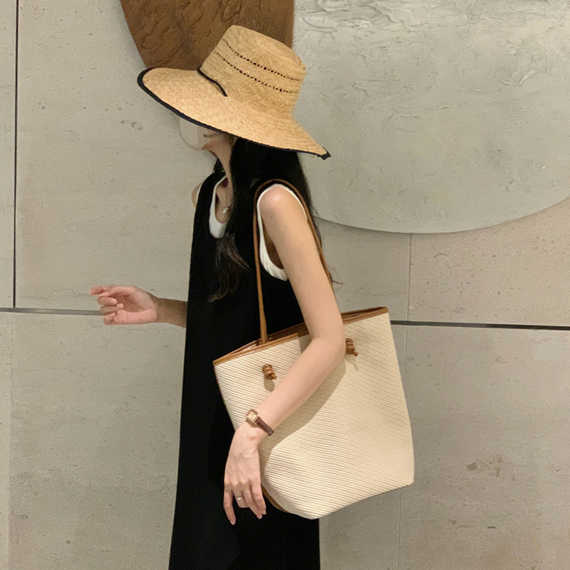 Vacation style leisure large capacity single shoulder tote 2024 new simple commuting big women's bucket baozi mother bag_voghion.com