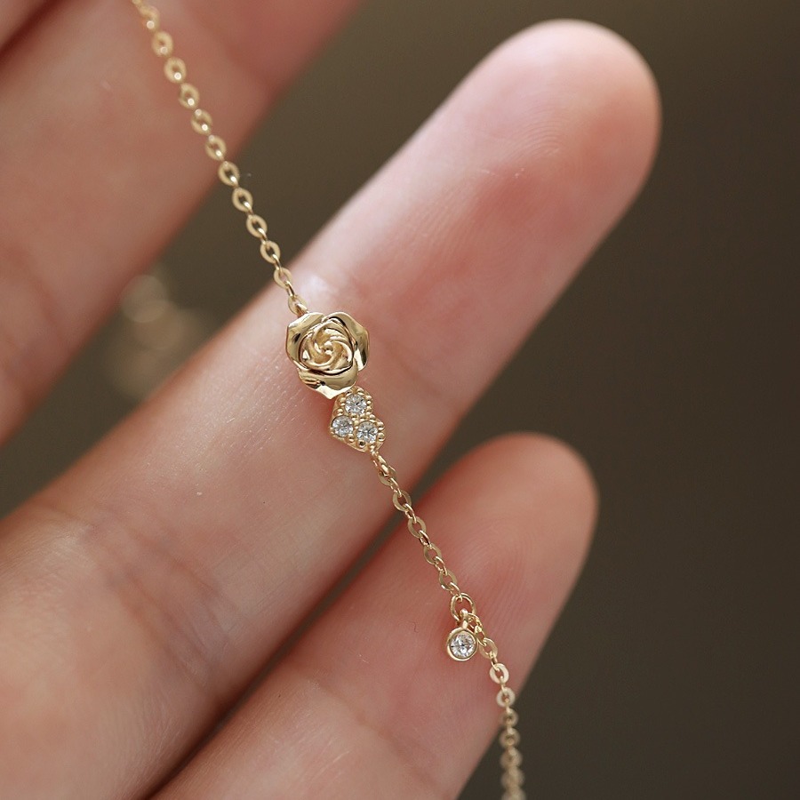Golden sophisticated bracelet with zircon