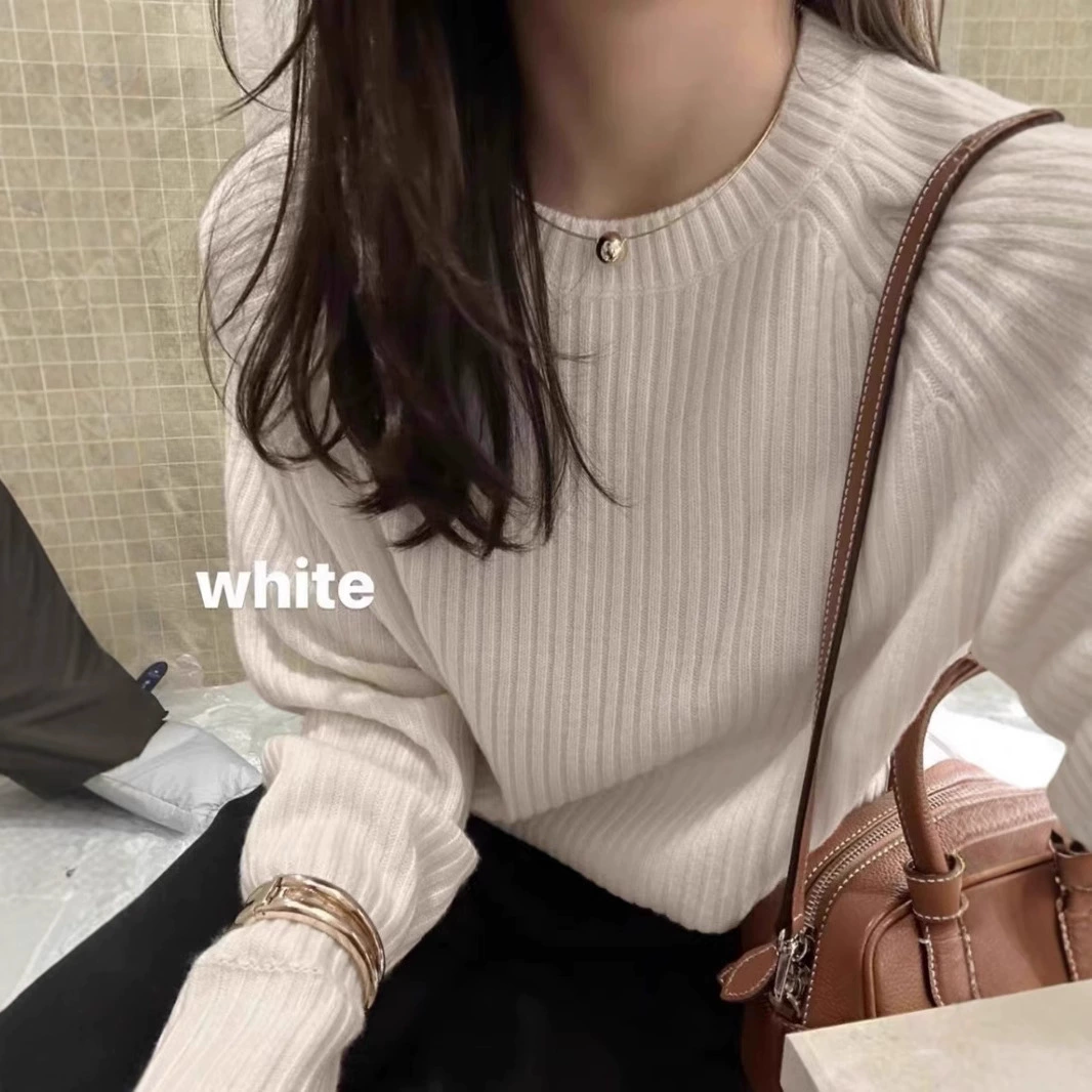 Solid demi-season woolen knitted short sweater with a round collar