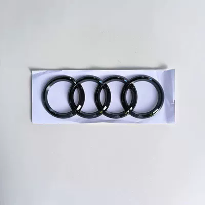Car logo TTS black lettering, center grille - standard-last-four-rings-glossy-black-remarks-model-year