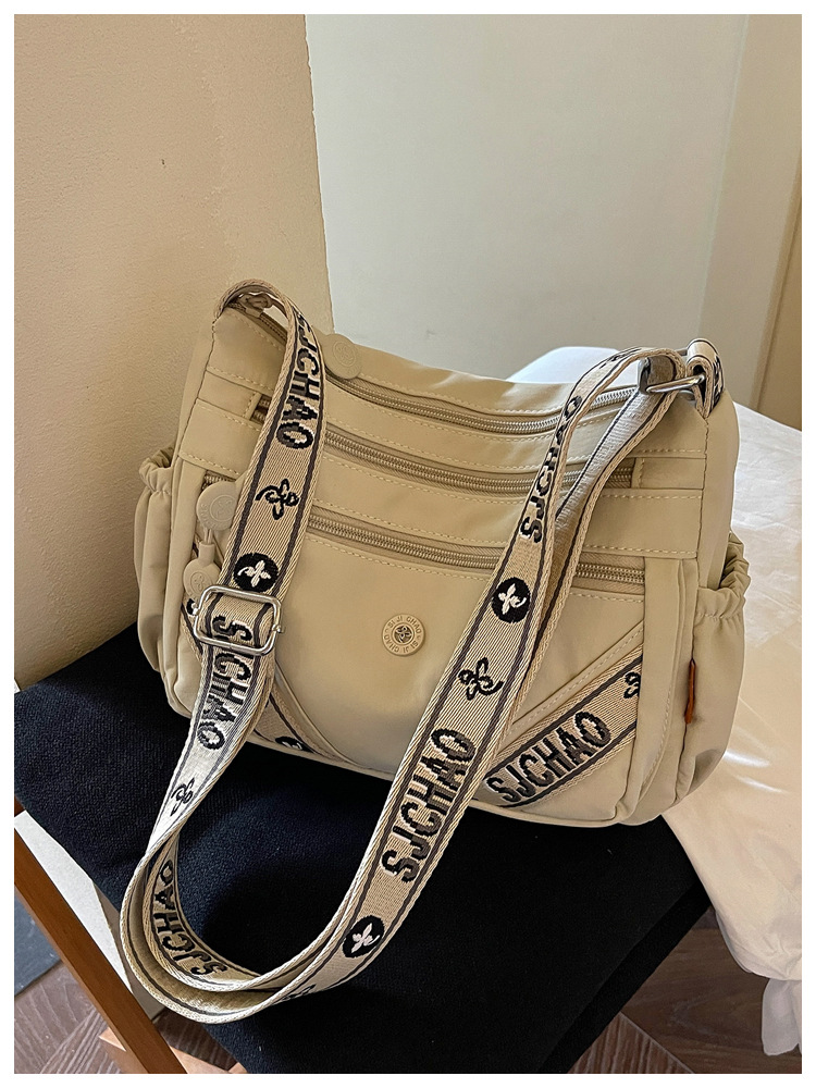 Bolsa de tela de nylon de gran capacidad de flujo para mujeres 2026 nuevo tipo de bolso de hombro ligero y simple de viaje a la oficina bolsa de ocio