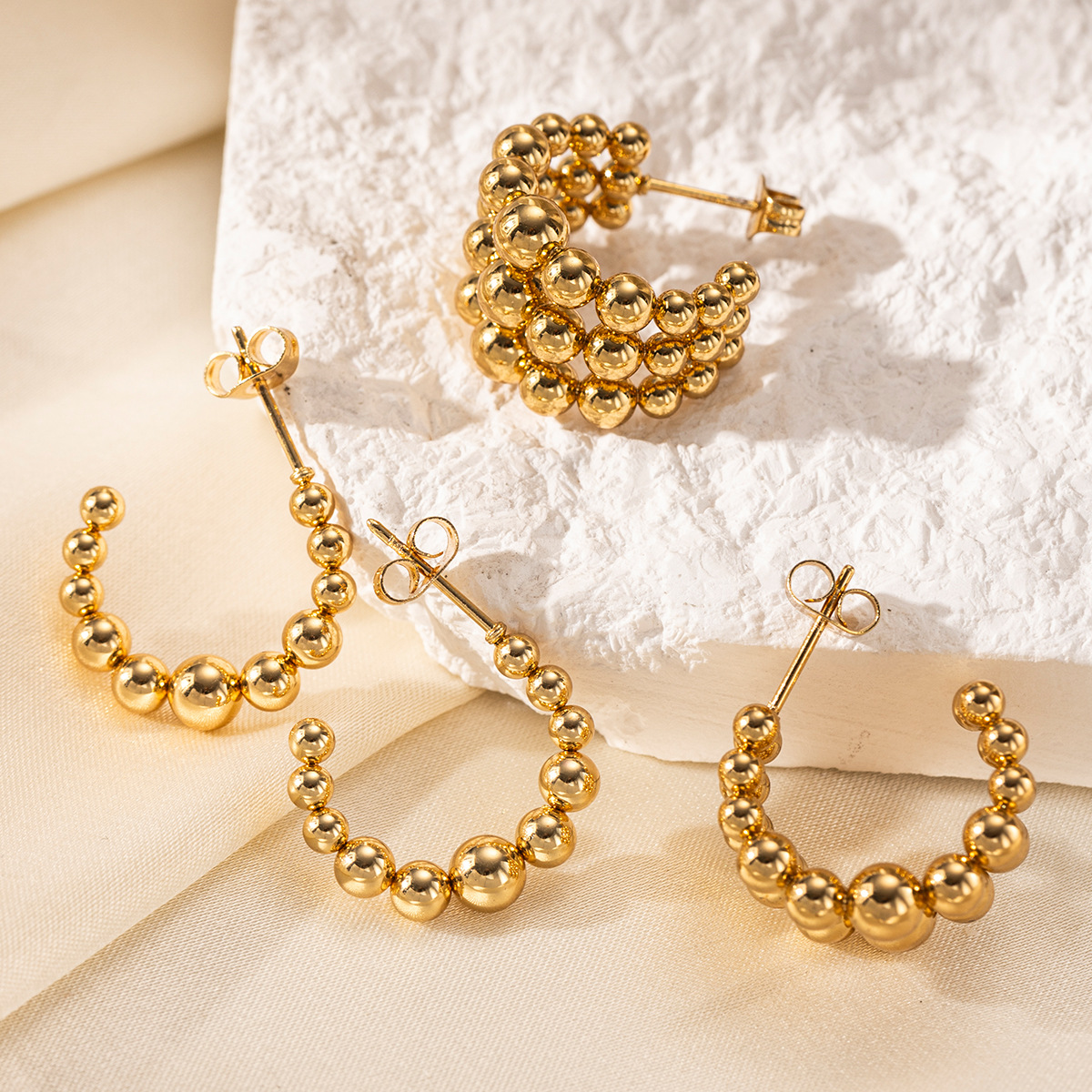 Taena Pendientes de acero inoxidable europeos y americanos, lujo ligero, costura redonda de alta calidad, pendientes semicirculares de acero de titanio, joyería femenina que no se desvanece
