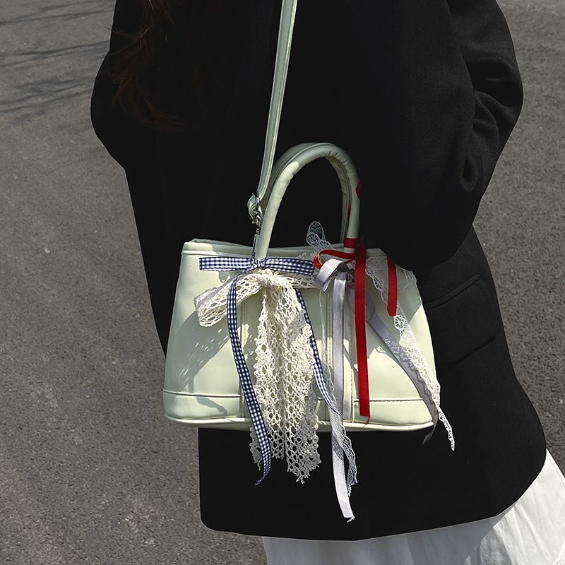 Bolsos de jardín portátiles populares de este año para mujer 2025 nuevos productos bolsos de hombro coreanos de nicho bolsos de cubo de todo fósforo de alta gama