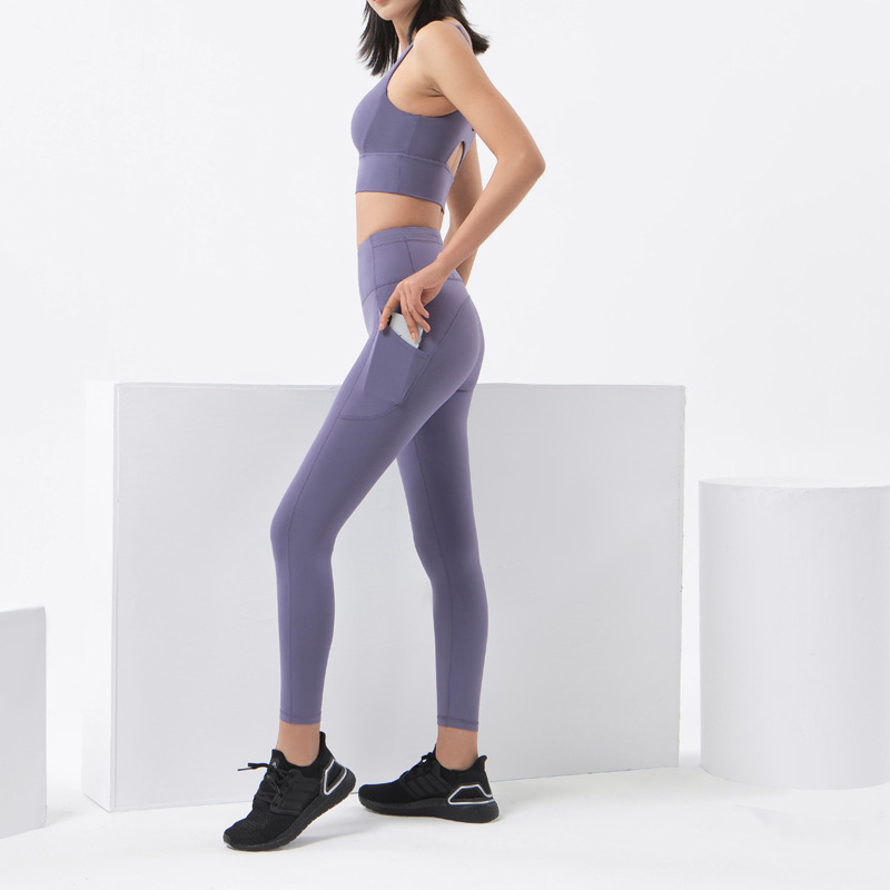 2022 bolsillo lateral desnudo apretado yoga pantalones de las mujeres de Europa y América cintura alta cadera elevación melocotón cadera deportes fitness Pantalones