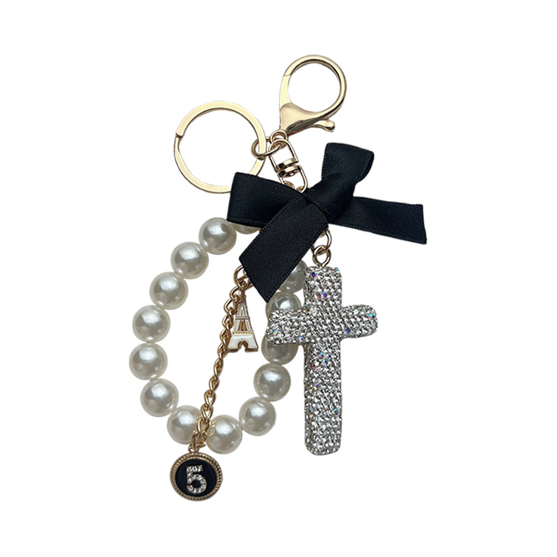 Nuevo arco de perlas de cerámica barro crucifijo llaves coreanas exquisitas llaves de automóviles colgantes bolsos colgantes