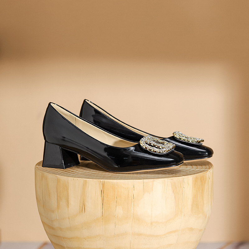 Fashionable black high heels made of patent leather