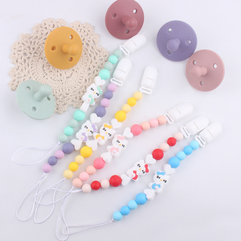 Nuevo KT gatos niños de silicona chupeta clips cadena bebé mordida cadena de dientes molares cadena anti-caída cadena pacificadora chupeta de goma de dente
