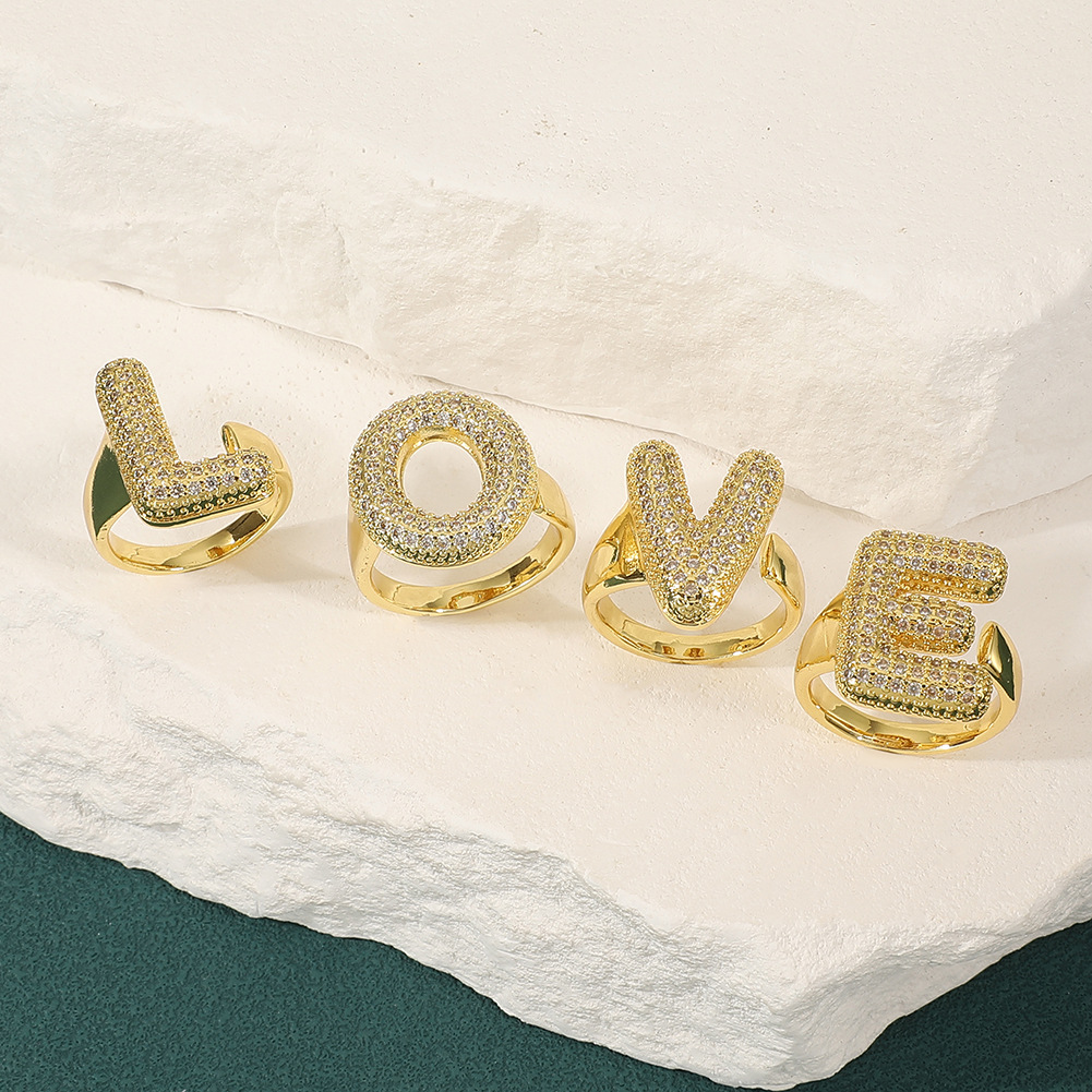 鸿玺希音temu跨境饰品26个英文字母戒指女镀金满锆石开口戒指指环