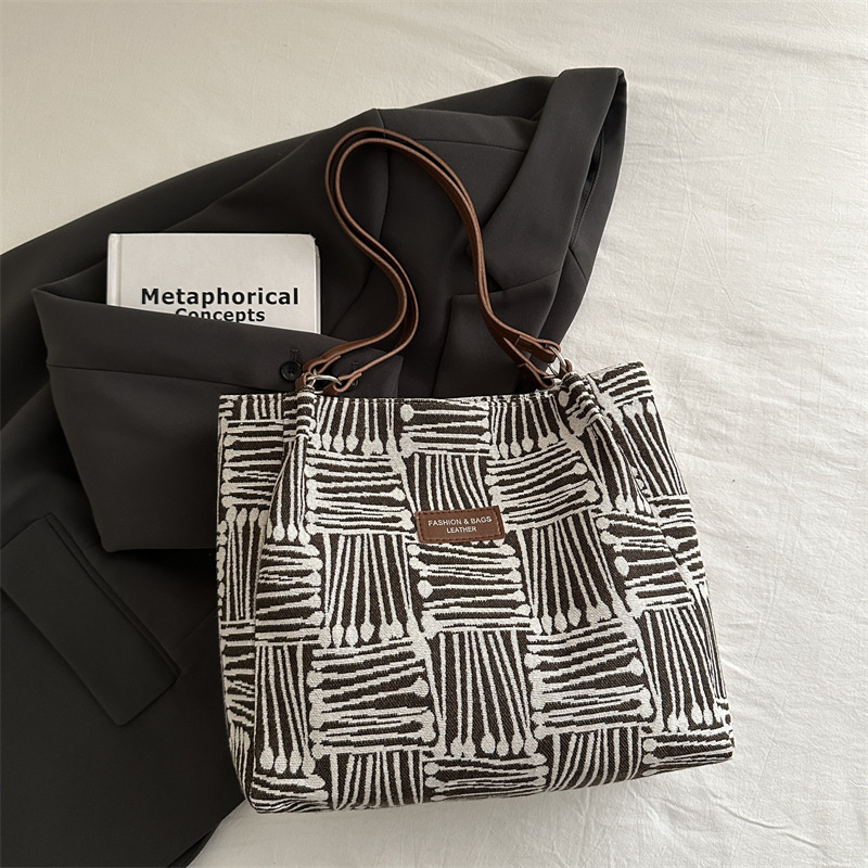 Bolso a rayas casual de todos los partidos de nicho para mujer 2024 nuevo bolso de hombro de gran capacidad de moda retro bolso de viaje