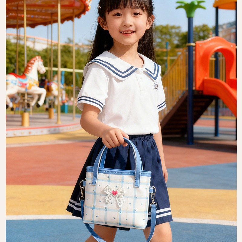 2026 nuevo bolso de niños lindos arcos de encaje bolsos de hombro para hombres y mujeres dulce bolso de mano para bebés