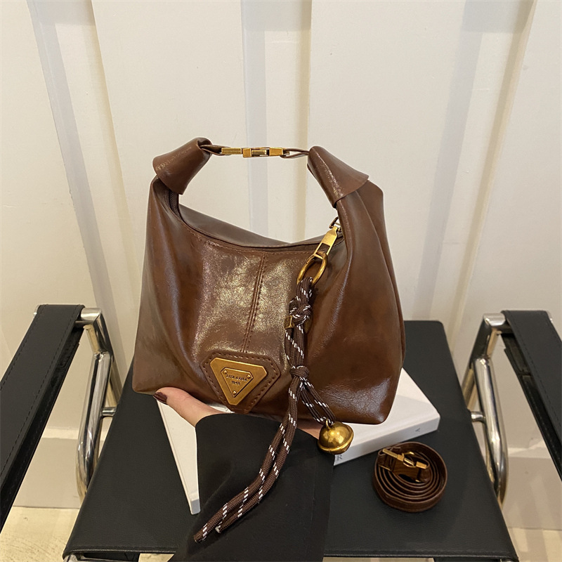 2025 nueva sensación de retro bolsos de mujer moda moda textura bolsos de hombro coreanos populares mochila de viaje