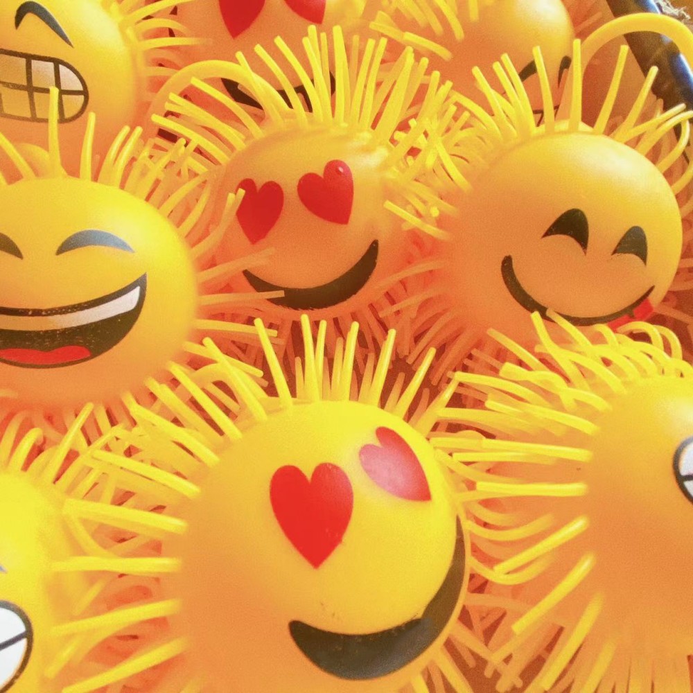 Juguete de dibujos animados expresión luminosa bola piel Smiley cara ventilación descompresión pellizco juguete la música de los niños dos Yuan tienda