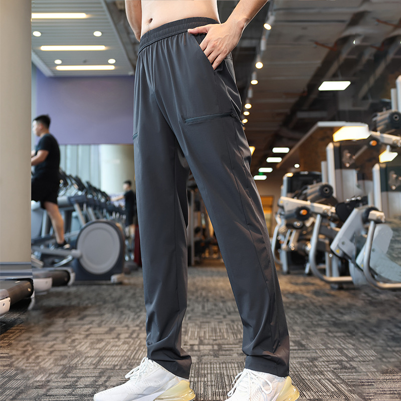 Pantalones deportivos elásticos de cuatro lados de nylon otoño de los hombres corriendo fitness casual Pantalones deportivos ligeros pantalones especiales americanos