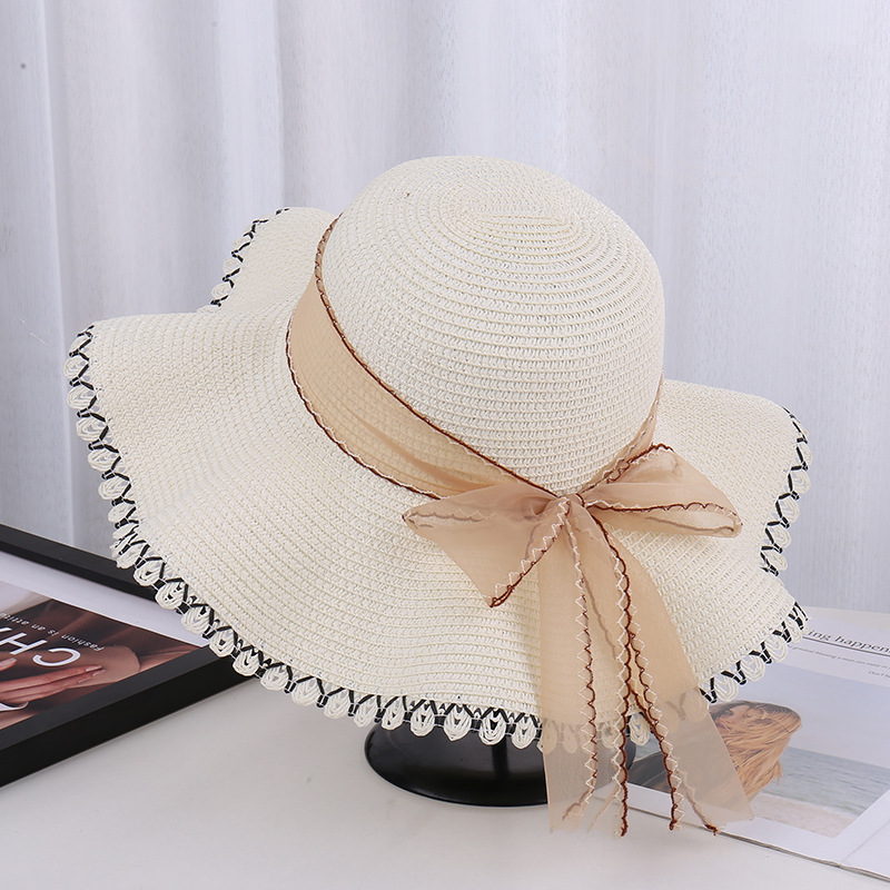 Summer large-brimmed straw hat for women with sun protection and…