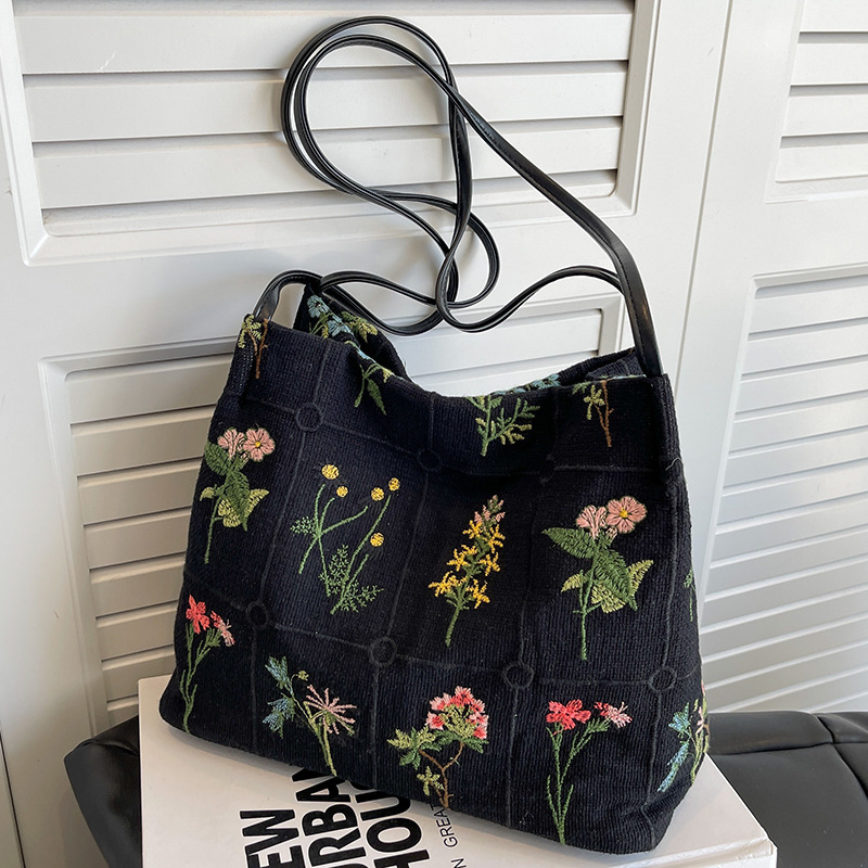 Bolso de mano bordado de gran capacidad para las mujeres 2024 primavera y verano nuevo nicho lienzo bordado bolso de cubo de cercanías
