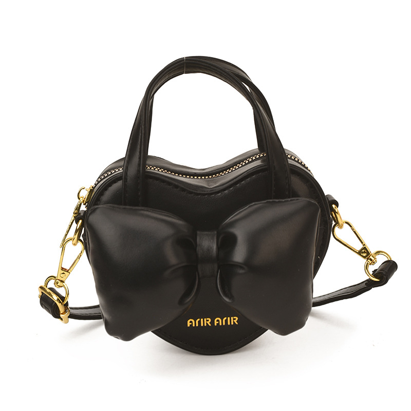 Mini lindos bolsos de mano en forma de corazón de melocotón, bolsos de hombro para bebés de color sólido, nuevos bolsos para niños transfronterizos