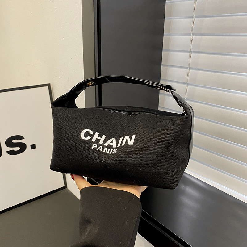 Bolsa de maquillaje de lona simple, nuevo estilo de aire extranjero, bolsa de mano de gran capacidad de almacenamiento, bolsa de almacenamiento simple para viajes