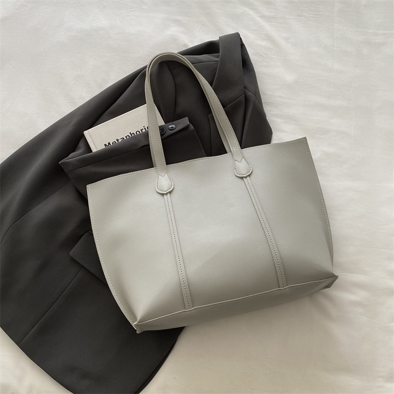 Bolsa coreana de gran capacidad de color sólido para mujeres 2024 nueva moda retro bolso de viaje simple bolso de hombro sólido