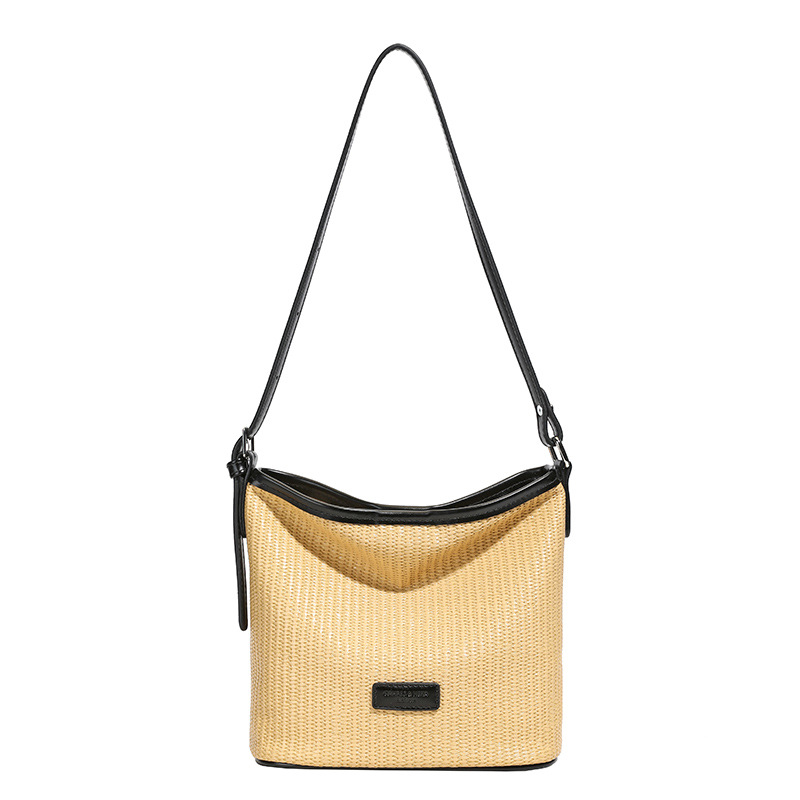 Verano nuevo estilo 2025 commuter vacaciones viento cubo bolso de hombro de estilo occidental de moda femenina bolso de mensajero de alta gama de nicho