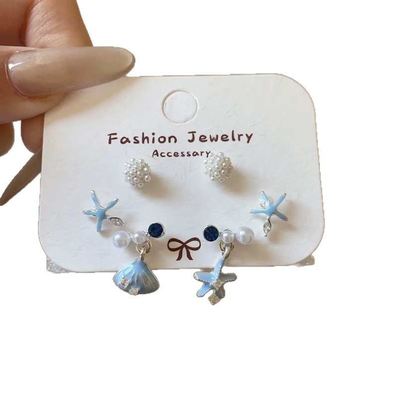 Pendientes redondos de color de aguja de plata Pendientes frescos y dulces Pendientes de todo fósforo de moda simple para mujer