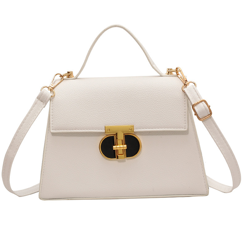 Bolsos de diseño de nicho a la moda para mujer este año: nuevos bolsos cuadrados pequeños con un moderno diseño de cierre, disponibles como bolsos de hombro o bandoleras en colores sólidos con una textura premium.