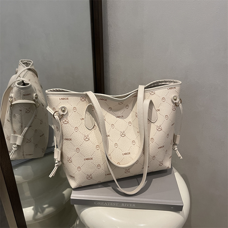 Bolso de mano transfronterizo coreano bolso de mujer otoño 2025 nuevo bolso de hombro de lujo ligero de textura alta bolso de brazo