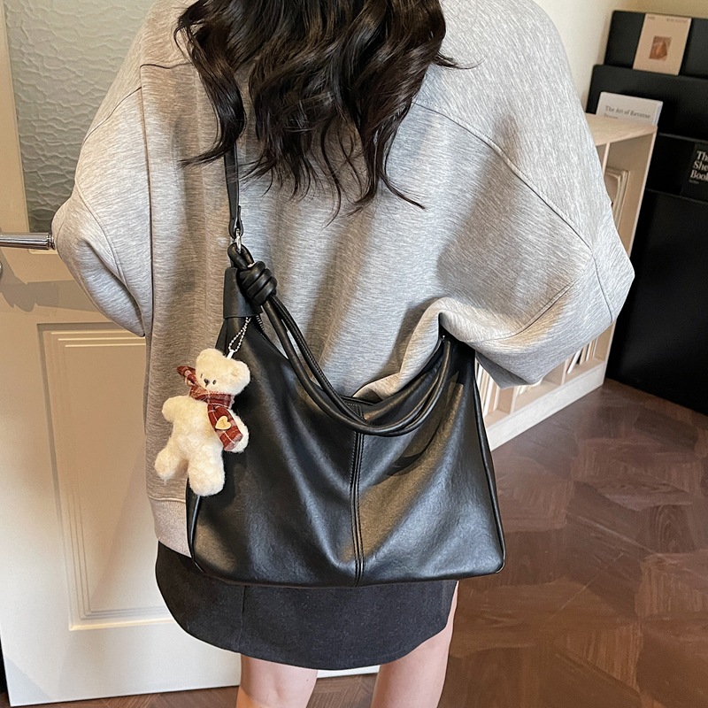Bolsos de textura para mujeres 2026 nueva moda popular simple sensación cotidiana bolso de hombro de gran capacidad bolsa de viaje