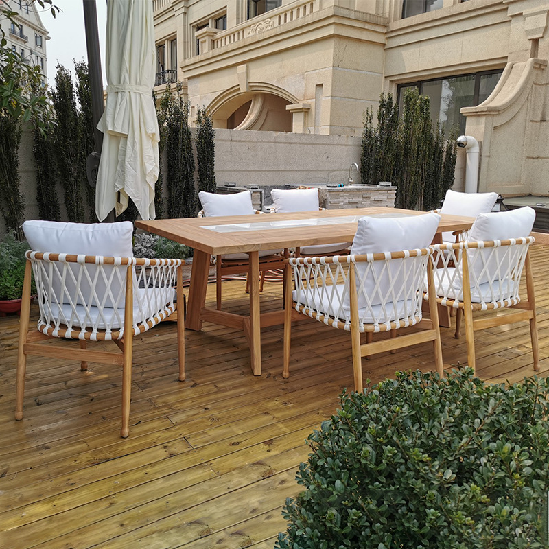 Mesas y sillas de teca para exteriores de villa, mesa larga de madera anticorrosión de diseño de alta gama para patio, jardín y hotel, con tejido de cuerda.