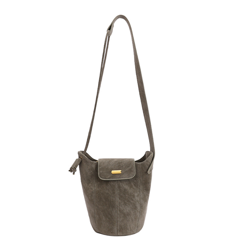 Bolsa de hombro coreana de estilo extranjero de gamuz, bolso de vestir, bolso inferior de mujer otoño-invierno 2025, nuevo nicho retro bolso de cubo de transporte