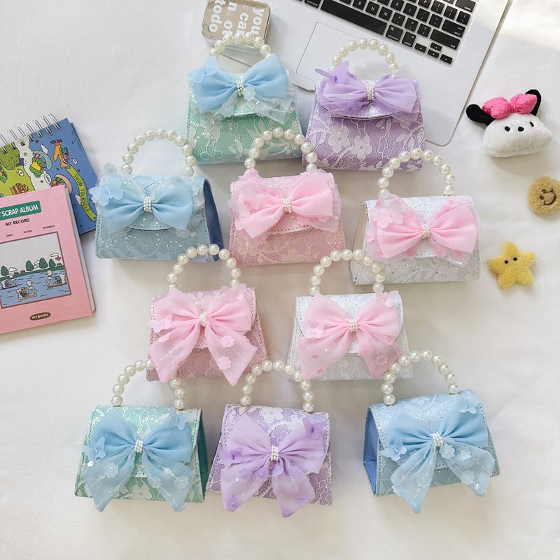 Bonito pequeño viento de la princesa viento bolso de perlas bolso de mano bolso de hombro para niños arco