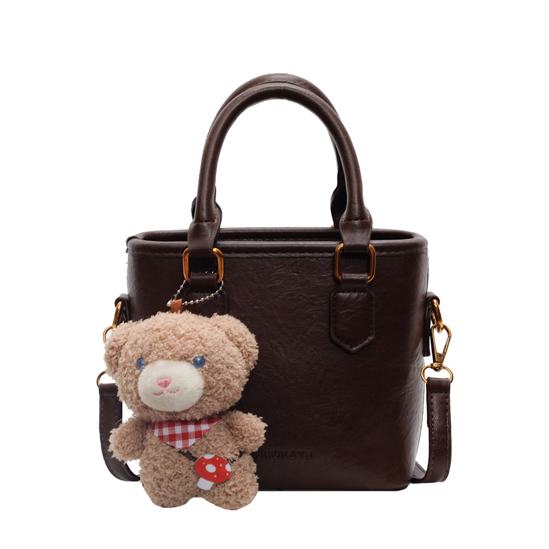 Bolsa de balde para mujeres 2024 nuevo retro versátil bolso de hombro portátil otoño-invierno súper caliente nicho de diseño de alta calidad bolso de mujer