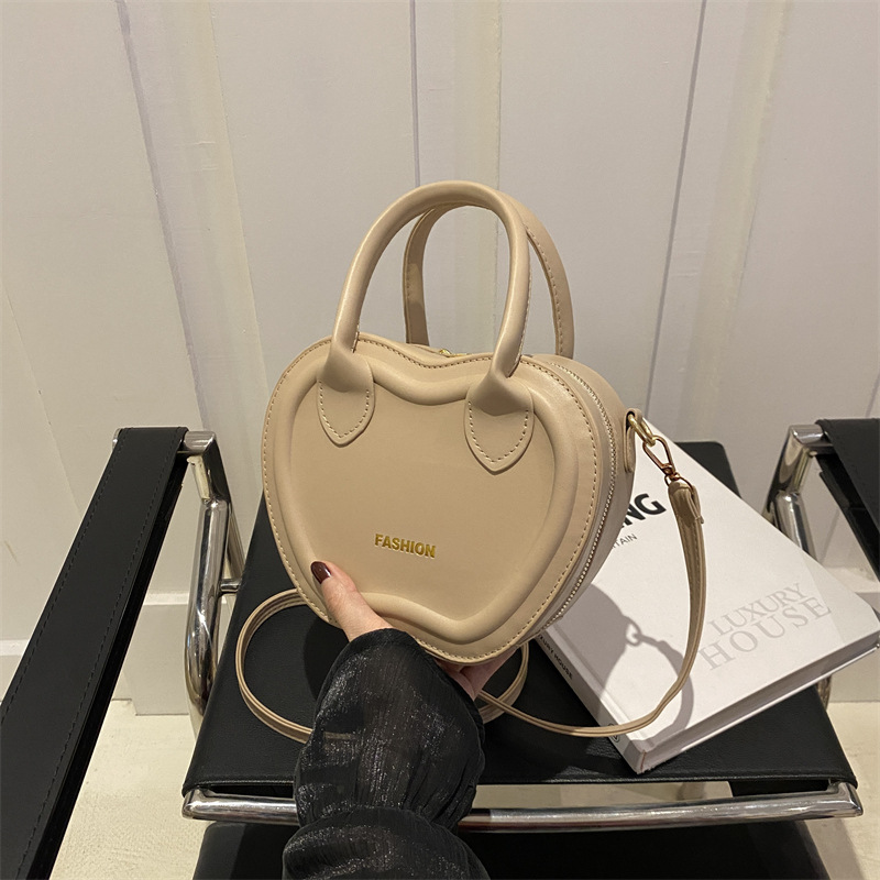 Bolso de mujer 2024 verano nuevo bolso de moda empujada textura PU bolso de hombro simple color sólido mochila de viaje