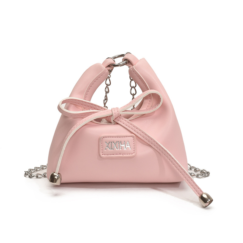 Bolsa de tendencia coreana para niñas, mini bolso de mano simple de color sólido, bolso de accesorios para niños de arco lindo