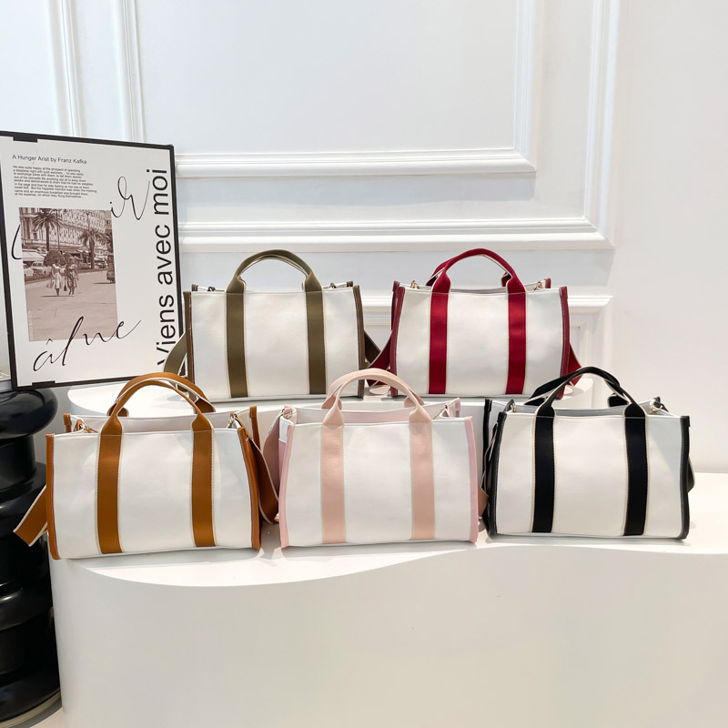 2024 invierno nuevo estilo de moda coreana ins bolso de lona de gran capacidad de viaje bolso de hombro bolso de colisión de color