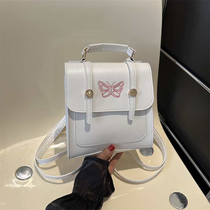 Estilo británico estilo coreano diseño de nicho ins hombro mochila bolso de las mujeres bolsa de cubo estilo universitario 2023 nueva bolsa de mensajero