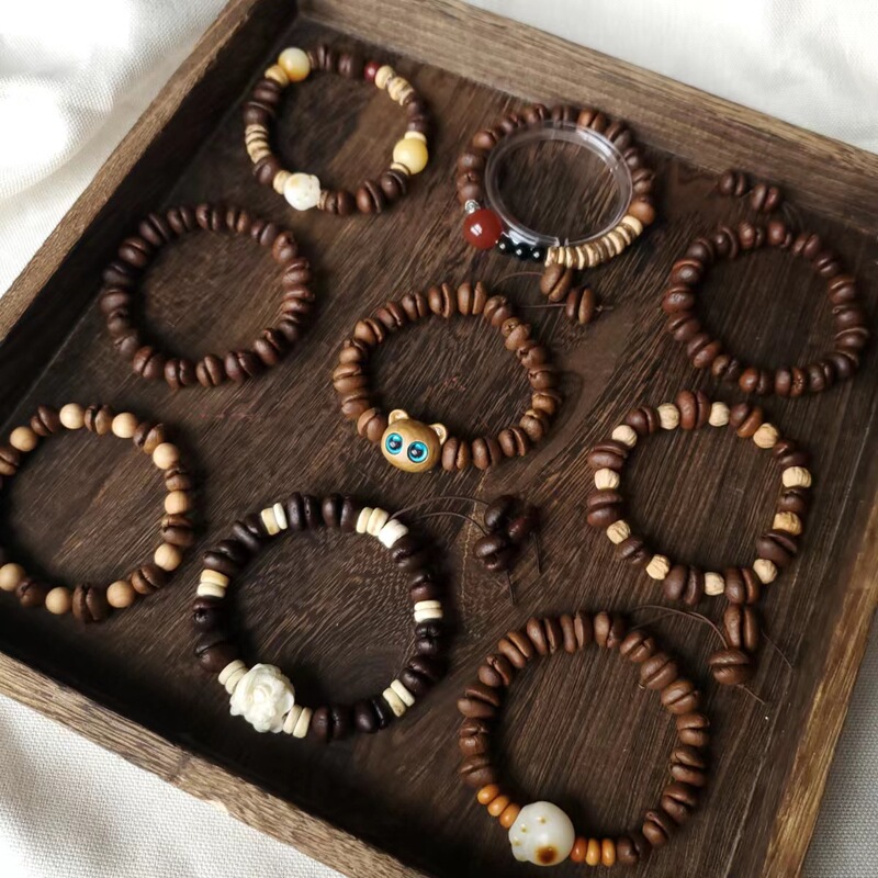 Factory direct coffee beans hand-punched bracelet sandalwood kitten head lion dragon seeds entity stall small