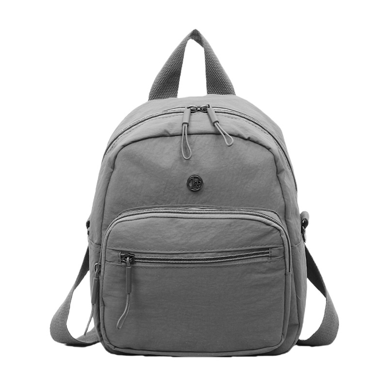 Mini mochila ligera coreana de moda casual mochila de viaje al aire libre de viaje de viaje simple mochila de estudiantes