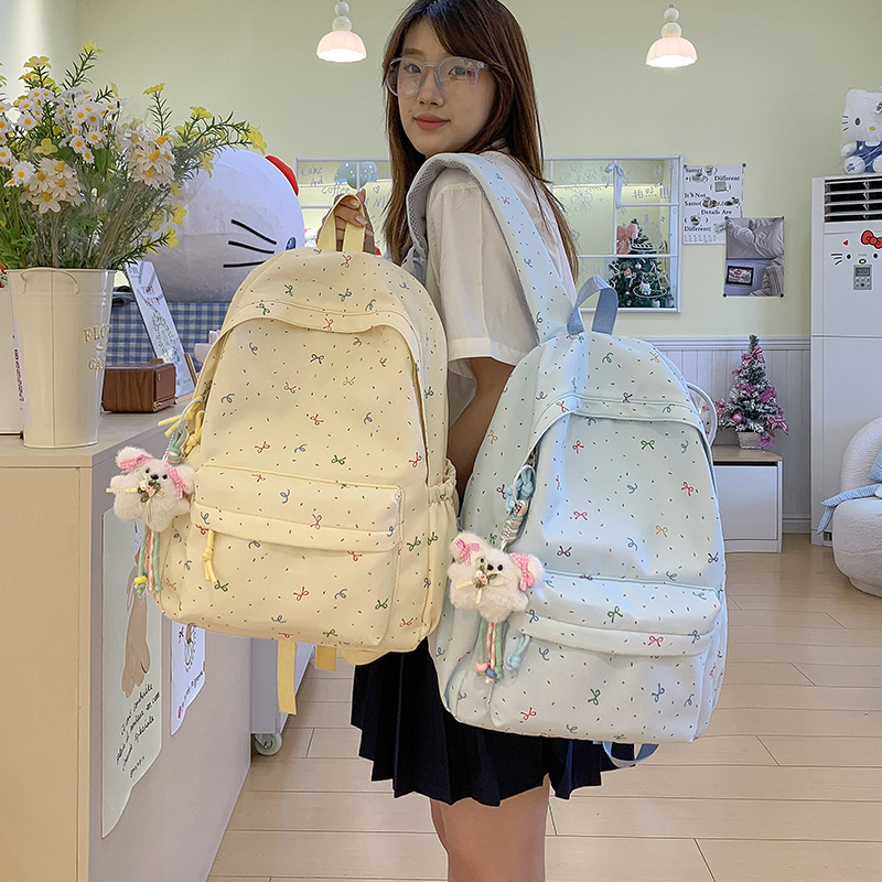 Wholesale high school and college student backpacks, featuring stylish designs, large capacity, printed patterns, and made with thickened nylon composite fabric